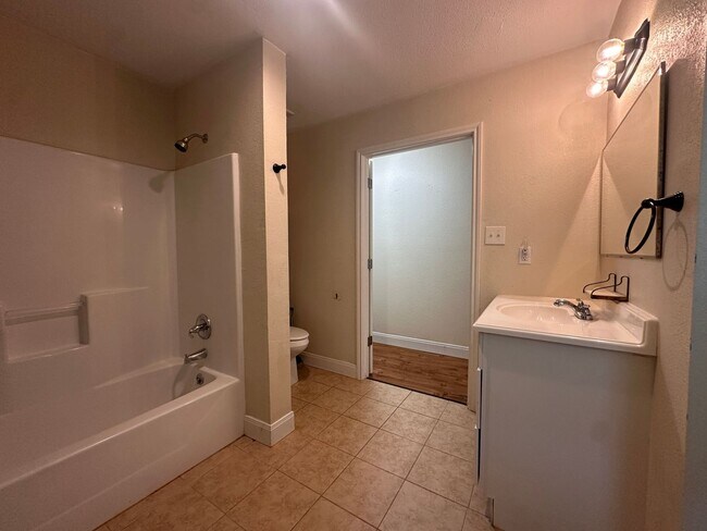 Building Photo - 2 bedroom 1 bath Duplex | Full Size Laundry Connections | Wood Floors