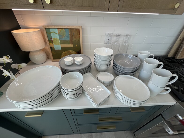 large set of Crate and Barrel dishes with many serving pieces. - 387 Commercial St