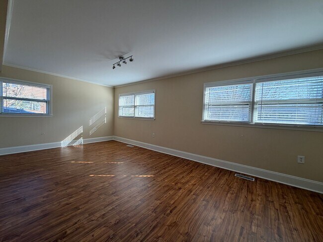 Building Photo - Freshly Painted Split-Level Home with Large Deck & Lawn Care Included