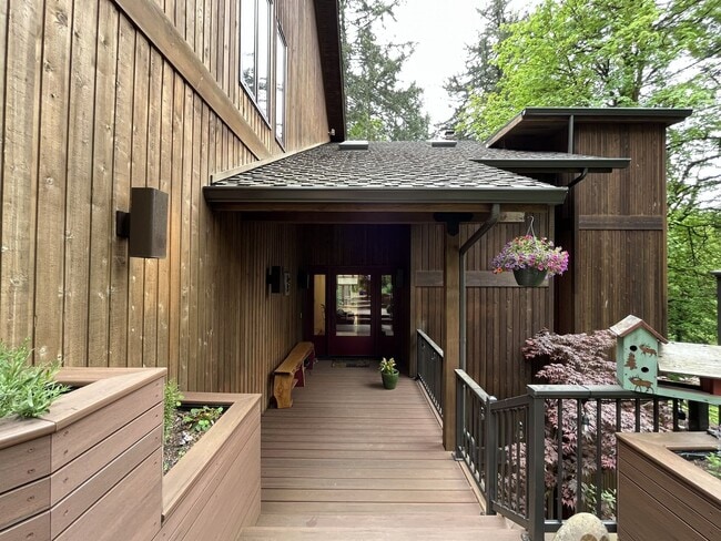Building Photo - One-of-a-Kind Custom Home with Wall of Windows, Stone Fireplaces, Expansive Entertainment Space &...
