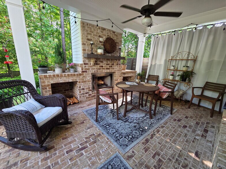 Covered patio with wood burning fireplace - 423 Johnson Ct