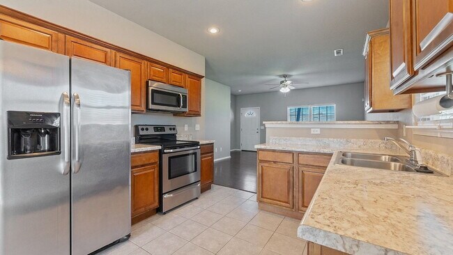 Building Photo - Spacious 4-Bedroom with Elegant Granite Finishes