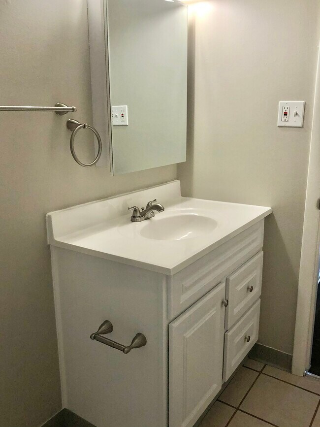 Experience the simplicity and elegance of this modern bathroom design. - GRACE LANDINGS APARTMENTS