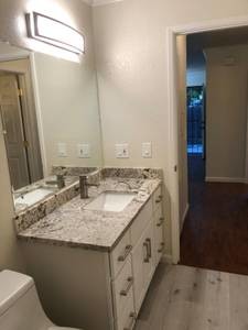 Mirror, sink, faucet, cabinet, granite - 375 N M St