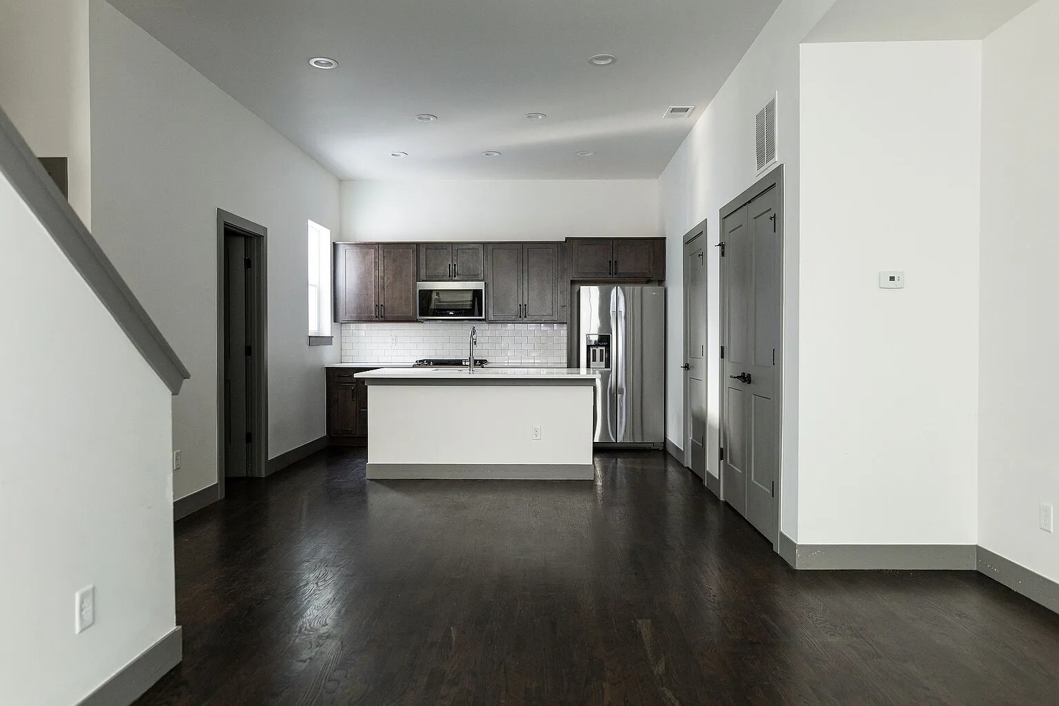 Living Room to Kitchen View. Main Floor Half Bath on left - 3505 S Marion St