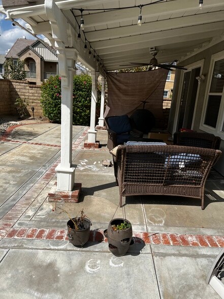 Patio in backyard - 24040 Dandelion Ln