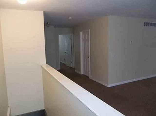 Looking into the unit from the front door towards the bathroom and bedroom. - 108 Heidi Ct
