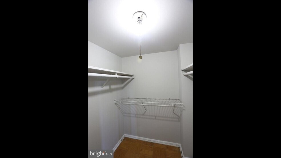 Walk in closet in master bedroom - 4949 Americana Dr