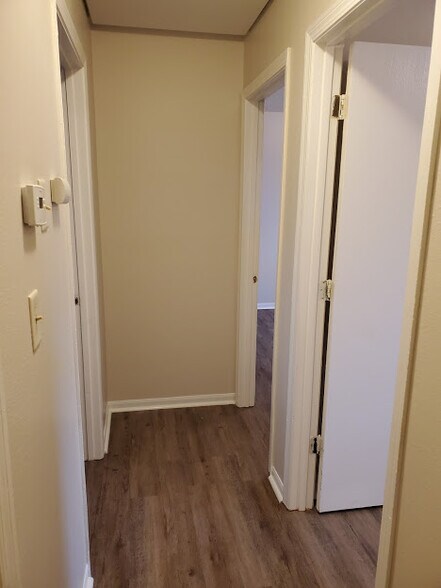 hallway with a new thermostat and CO Monitor - 4460 Santa Barbara
