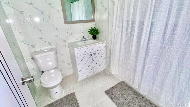 Building Photo - 70-25 Queens Blvd