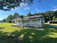 Building Photo - Your Slice of Serenity : Country Charm Awa...