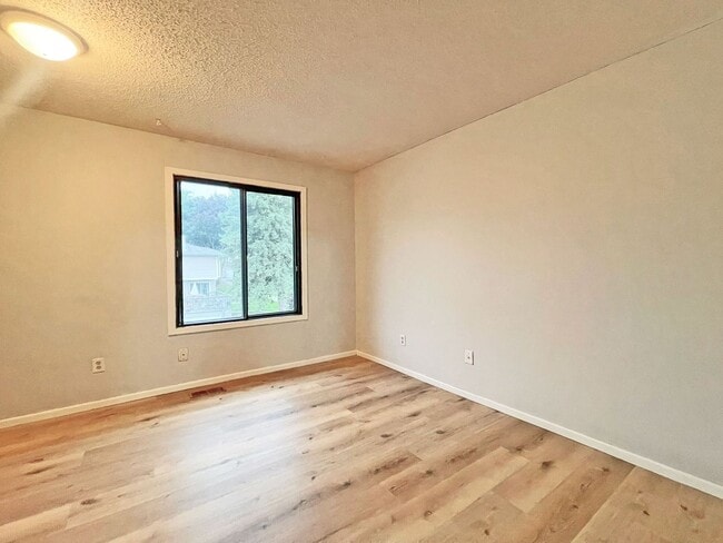 Building Photo - Spacious End-Unit Townhome with Fireplace, Family Room, 2-car Garage, Community Pool & Playground...