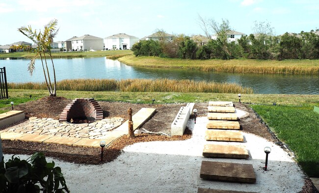 Xeriscape back yard with fire pit - 5128 Rocky Coast Pl