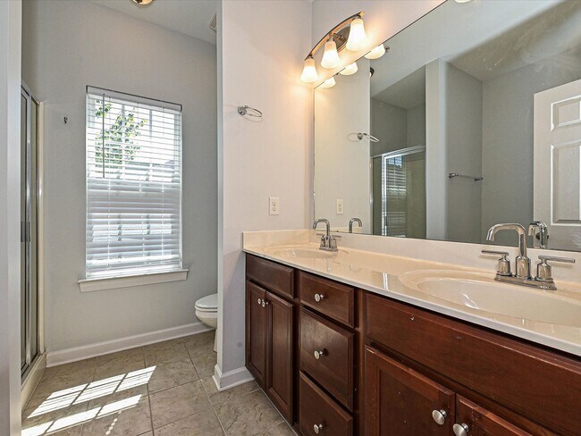 Building Photo - Stylish Condo Living with Open Concept, Garage & Outdoor Space