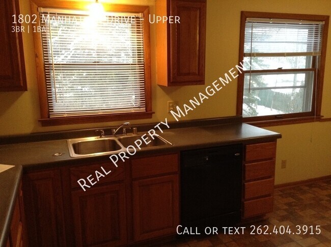 Building Photo - 1802 Manhattan Dr