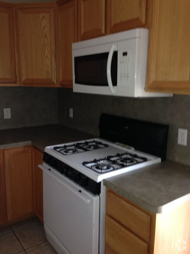 Building Photo - THREE BEDROOMS TWO BATHS, FENCED BACKYARD,...
