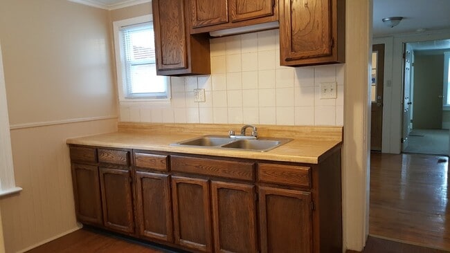 Kitchen cabinets, notice natural light - 416 Henry St