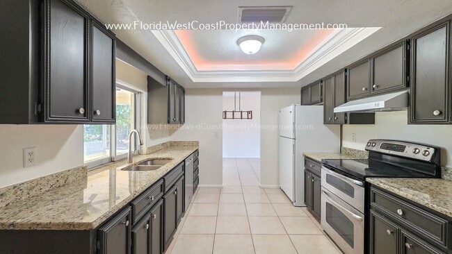 Building Photo - SPACIOUS SARASOTA HOME WITH LARGE FENCED YARD! MOVE IN READY! ALL TILE/ NEW LVP!