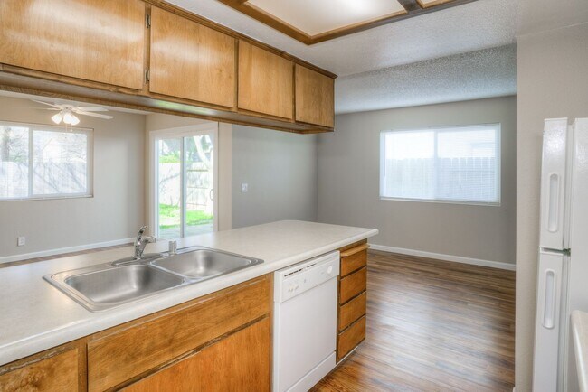 Building Photo - Greenwood Estates has an Excellent 2 Bedroom, 1.5 Bath Townhouse with a Backyard and Garage!