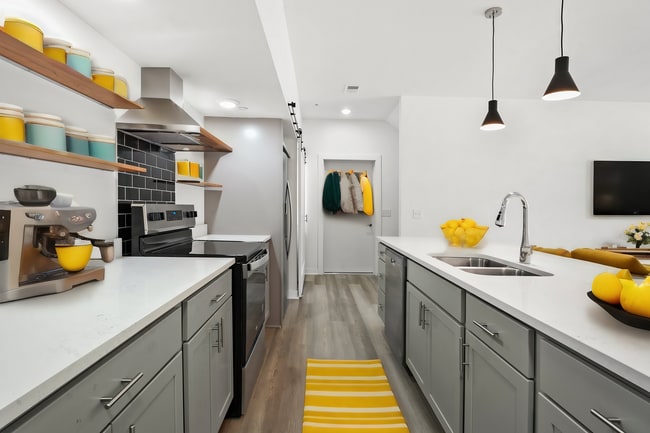 Kitchen w/ Garage Entrance (1st floor) - Point Gardens Apartments