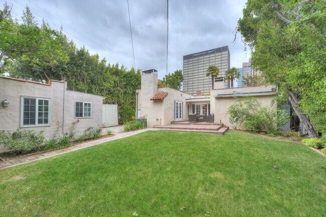 Building Photo - Welcome to this beautifully updated Spanis...