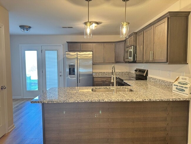 Building Photo - New Construction in the Heart of St. B! 2BR/2.5BA Minutes from the Best Shopping, Dining, and I-2...