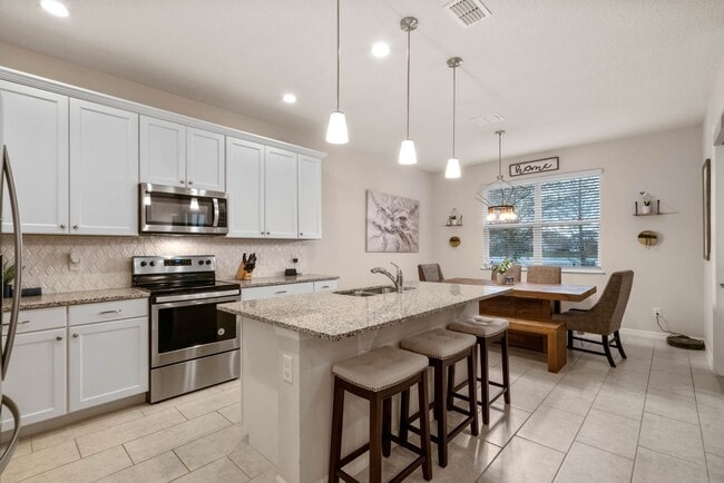 Building Photo - Water Front Home- 4 Large Bedrooms-3 baths Gated Community Call Sheila Campbell 407-687-7900