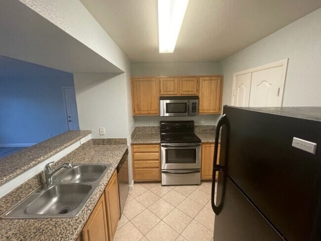 Building Photo - AWESOME 2 BEDROOM UPGRADED CONDO NEAR STRIP W/ RV PARKING!!!