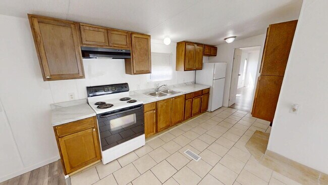 Building Photo - "Charming 3-Bed, 2-Bath Mobile Home Retrea...