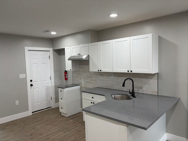 Building Photo - Newly Renovated 2- Story Townhome with Front Porch and Back Yard