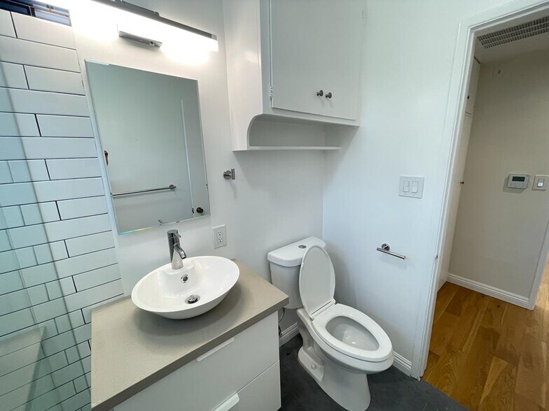 main bathroom with full bath - 7855 W Manchester Ave