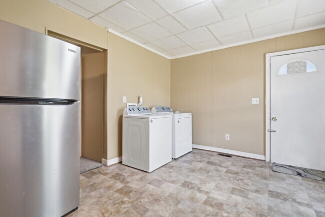 Building Photo - This well-maintained 4-bedroom, 2-bath duplex offers a spacious layout with all the comforts of h...