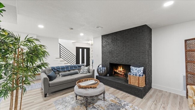 Building Photo - Renovated Mid-Century Modern Home in Belmont West with Finished Basement & Fenced Yard