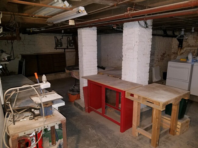 Basement with washer/dryer and full wood-working bench - 713 Stokes Ave