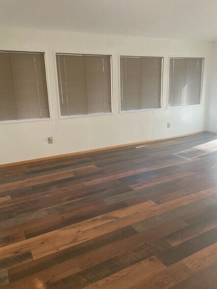 Large living space with several windows offering tons of natural light - 240 W Kyle Dr