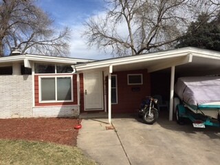 Front of House with Carport. Parking space available for three cars - 1224 Westward Dr