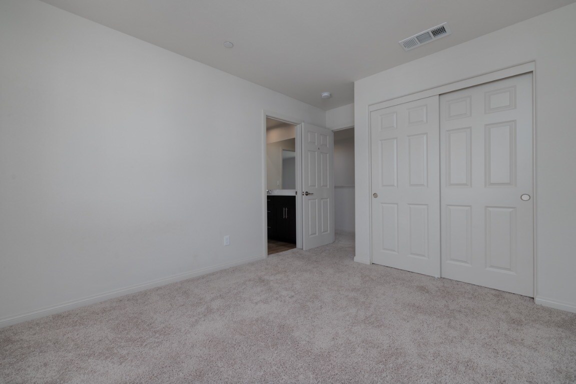 Another view of the second upstairs bedroom showing the main entry door - 26549 Brightstone Dr