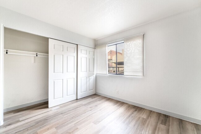 Building Photo - Upgraded Three-Bedroom Condo with Wood Flooring and Modern Comforts!