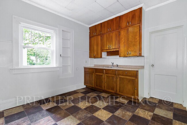 Building Photo - Charming 3BR Home with Classic Woodwork, Porch & Bonus Attic Space