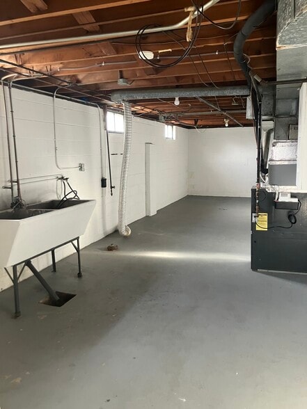 Basement with W/D hookups and storage area - 3802 Burton Ave