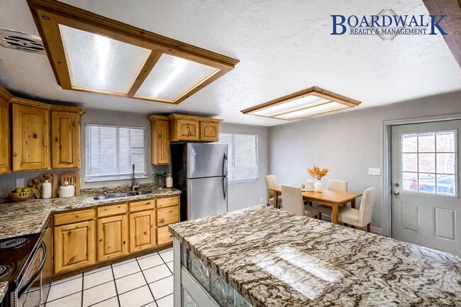 Building Photo - Spacious 5-Bedroom Home with Lofted Garage