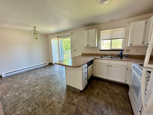Kitchen with breakfast nook - 13409 E 8th Ave