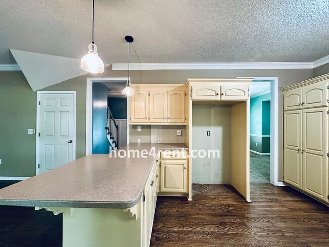 Building Photo - Blue Valley Schools w/ Wood Floors, Finished Basement and a Peaceful, Private Fenced Yard!