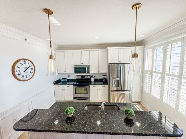 Building Photo - Fully Furnished Waterfront Elegance on Mai...