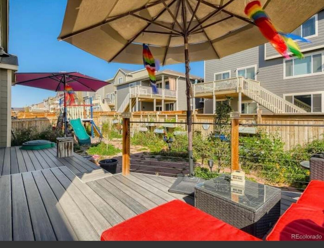 Backyard with plenty gardening boxes and sprinkles drip lines. Apple trees persimmons. - 9260 Rifle St