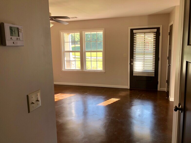 View of living room from hallway. Front porch behind windows - 80 Villa Lane