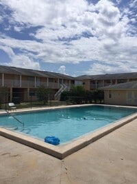 Building Photo - 1.1 New laminate flooring - looks amazing- Community Pool and Laundry facility