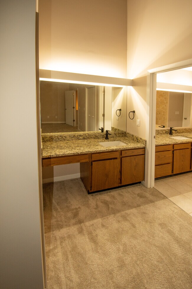 View of in suite sink and cabinets - 115 Beechnut St