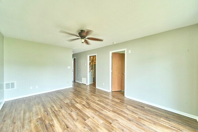 downstairs living room with access to bedroom and laundry room - 1080 Fairlane Ct