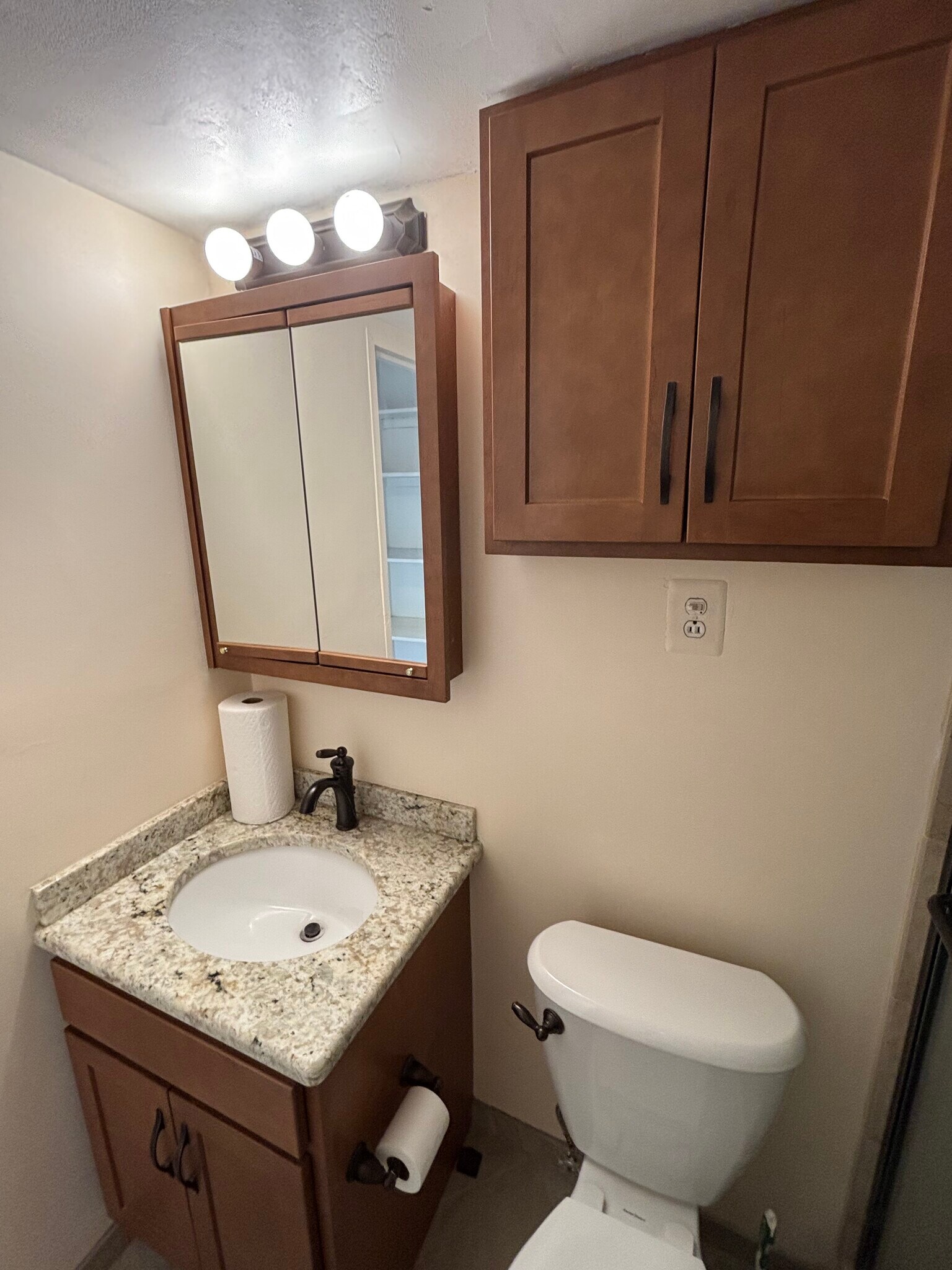 Bathroom sink with new cabinets - 1330 New Hampshire Ave NW
